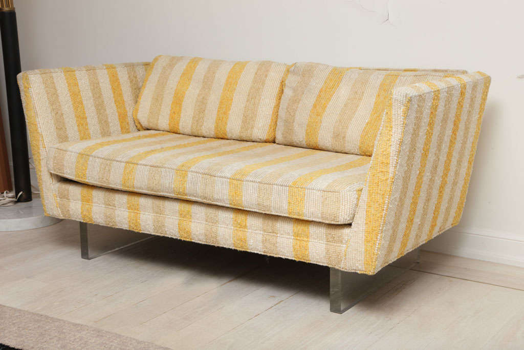 Vladimir Kagan couch with sleek, moderne lines and lucite plank legs.