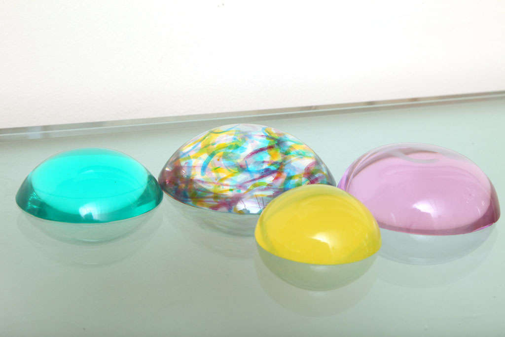 These small collection  of 3 color lucite orb sculptures bring light to any tabletop or floor... the confetti colored one accents all the others, with the array of yellow, turquoise jade green, and purple
Norman Mercer lucite pieces are quite