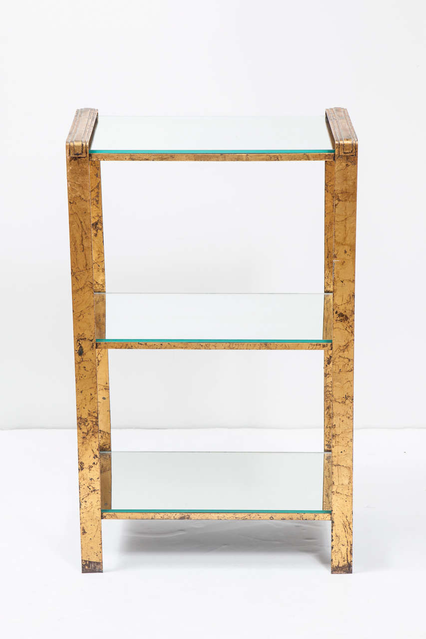 This nice looking gilt metal étagère will three mirrored shelves can go anywhere, living room as a side table, bedroom, bathroom, or even as a small bar.