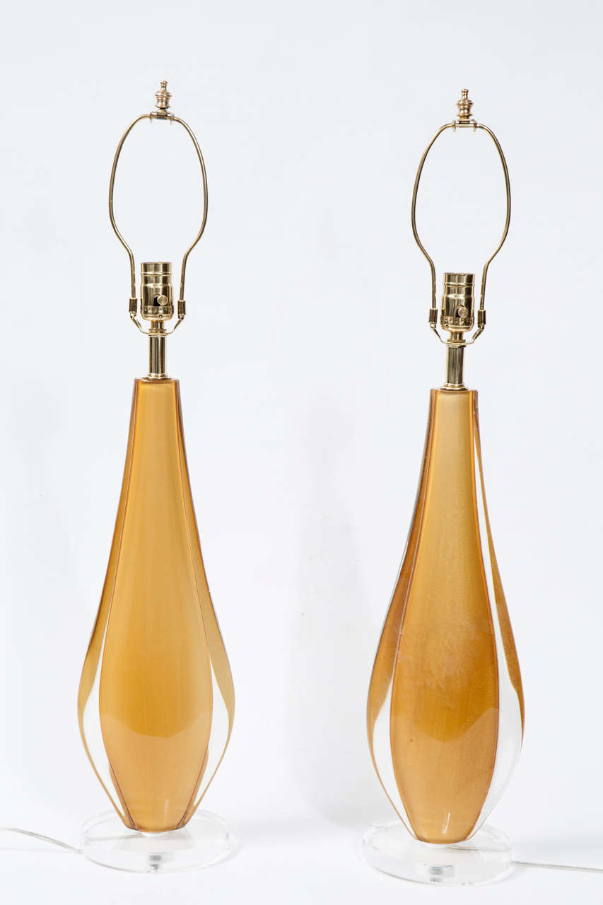 An unusual and elegant pair of Murano glass lamps in a 