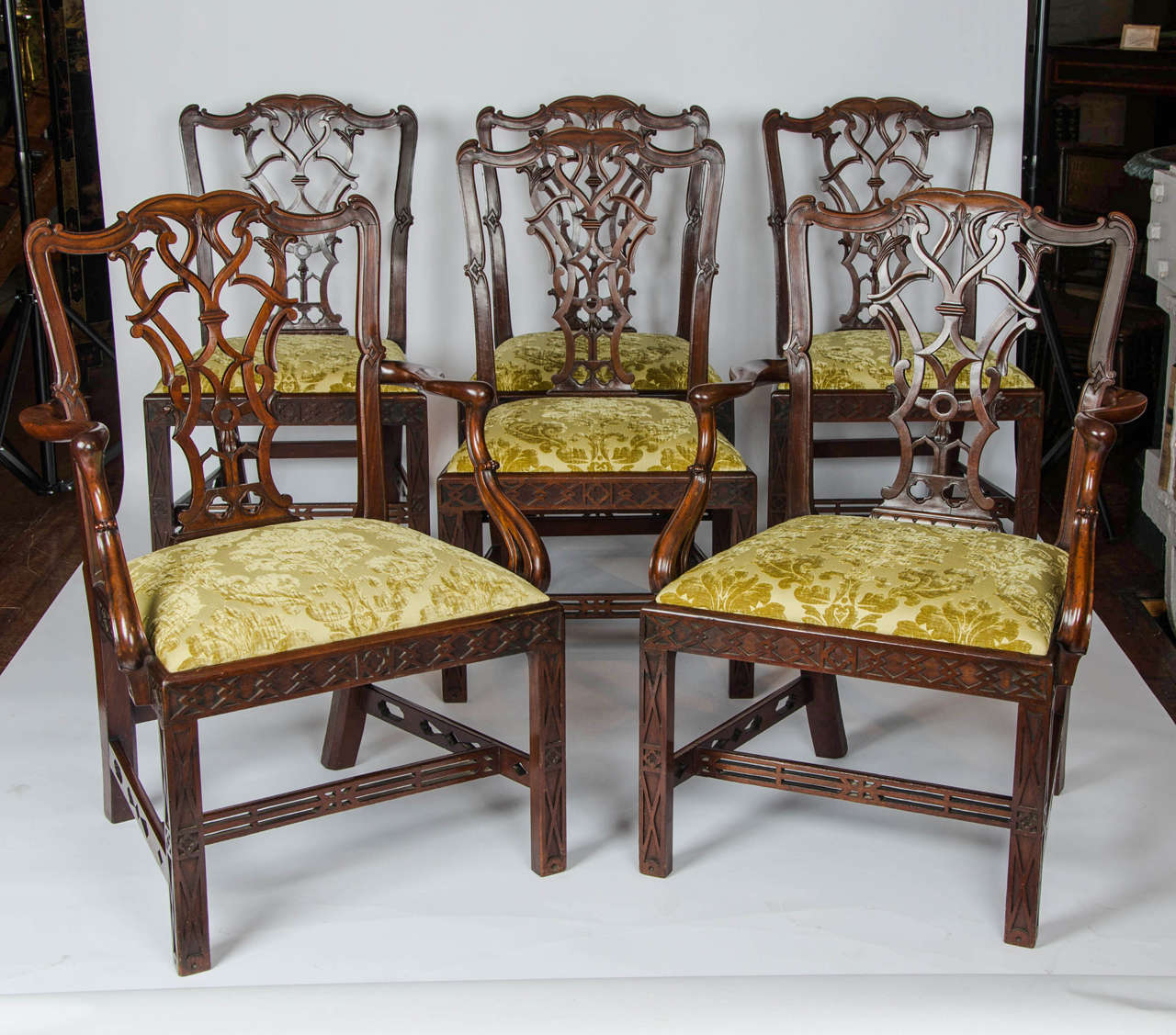 A superb set of six 19th century mahogany centennial dining chairs in the Chippendale style. The intricately carved splat backs above drop-in seats with blind fret moulded frame and legs and pierced stretchers and arms.