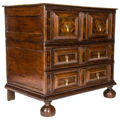 An early laburnum veneer oak chest of drawers.