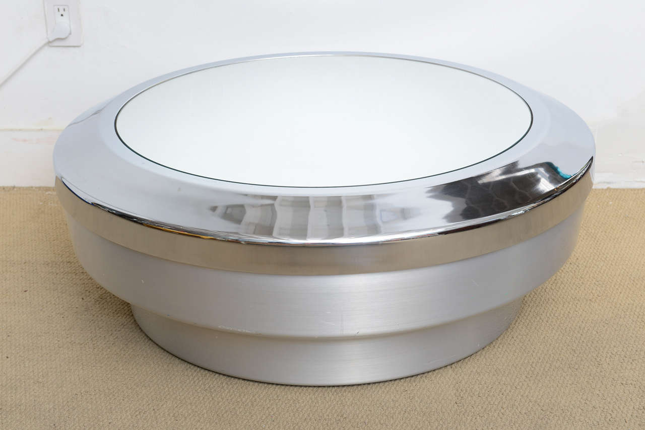 Modern 1970s coffee table polished chrome and satin aluminum base with all original mirror top.