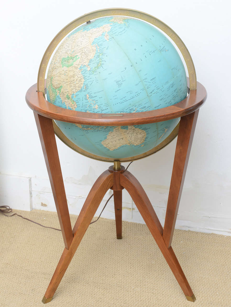 All original excellent condition stand and globe designed by Edward Wormley for Dunbar. This piece was a gift to Mr. Charles T. Samek for 30 years of work for the Bell Laboratories.