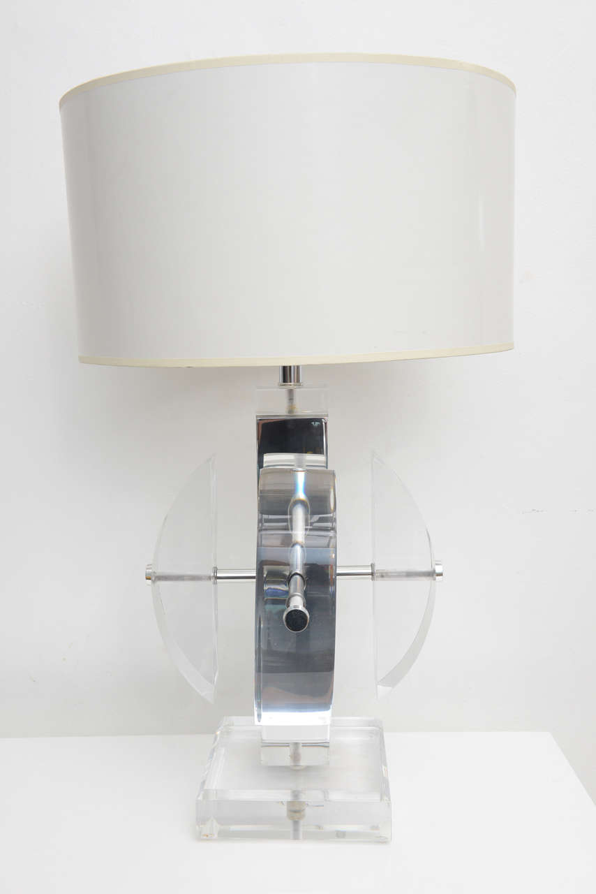 Amazing Lucite lamp Karl Springer style. Excellent quality, thick Lucite and the hardware is hi-end as well dual bulb casing nickel-plated brass. This lamp does not require a pair it stands on its own. Lamp has been re wired and Lucite as well as