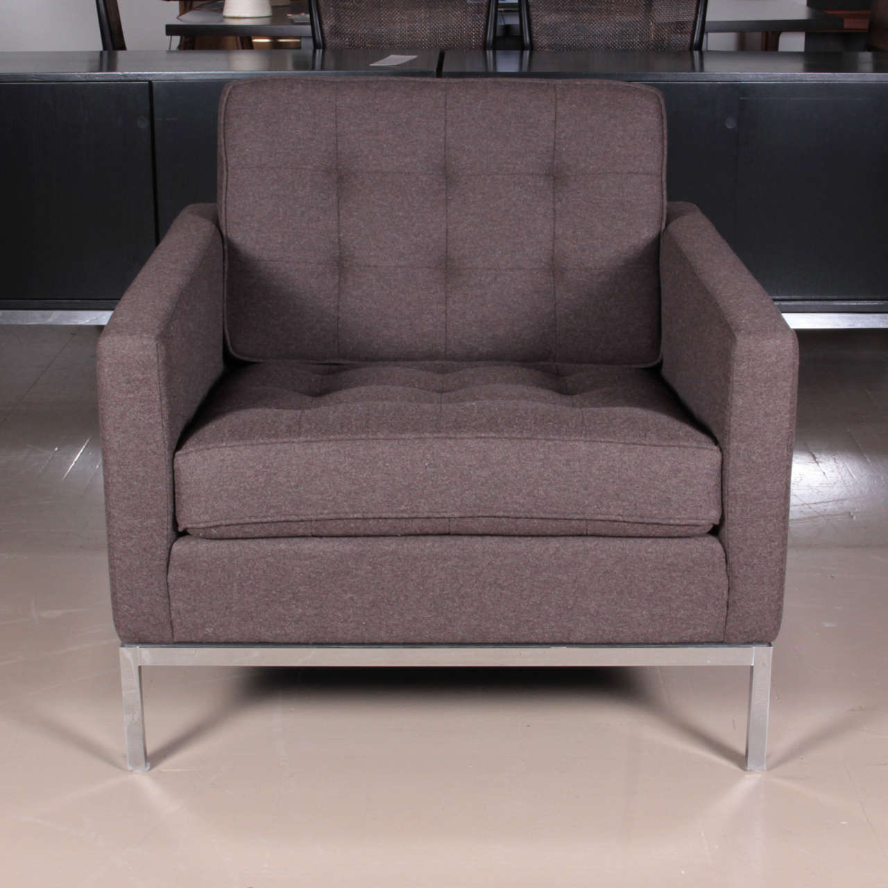 Florence Knoll classic club chair, reupholstered in brown felt, on chrome frame.