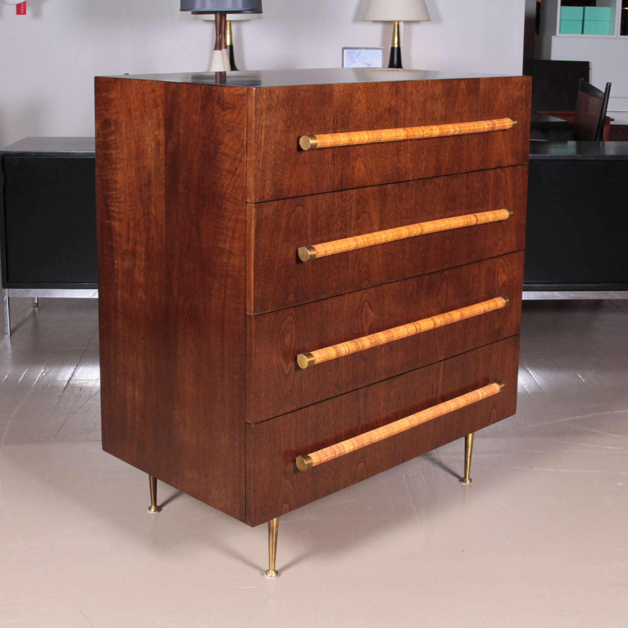 Four-drawer dresser with raffia wrapped handles capped in brass and brass tapered legs designed by T.H. Robsjohn-Gibbings for Widdicomb, circa 1950s.
Excellent restored condition.