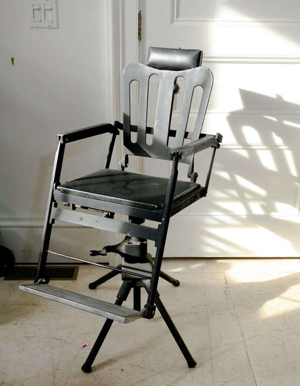 19th c. cast iron dentists chair, probably used for a child.  Collapsible stand and<br />
adjustable seat  head and foot rest.