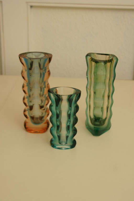 Czech art glass multi-colored vases by Egermann Exbor designed by Pavel Hlava. Price listed is for the group of three. Also priced individually.The smaller vase $775.  Two larger  vases priced at $975. each.