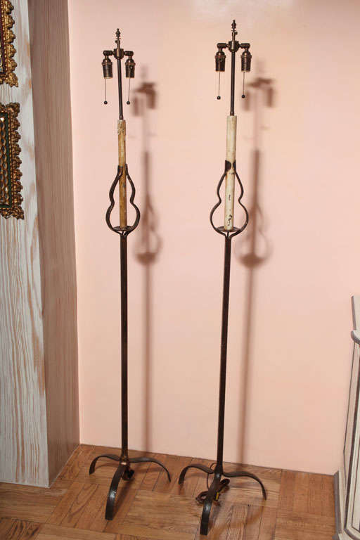 A Pair of French Provincal Wrought Iron Floor Lamps