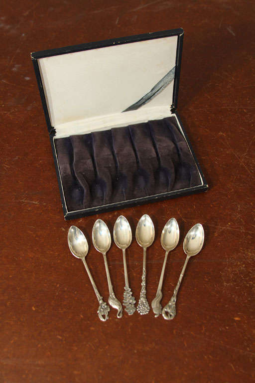 Set of 6 Japanese Silver Demitasse Spoons in original presentation box. Each spoon has a different design: tortoise, chrysanthemum, fans, bamboo, crane and flower (type unknown).
