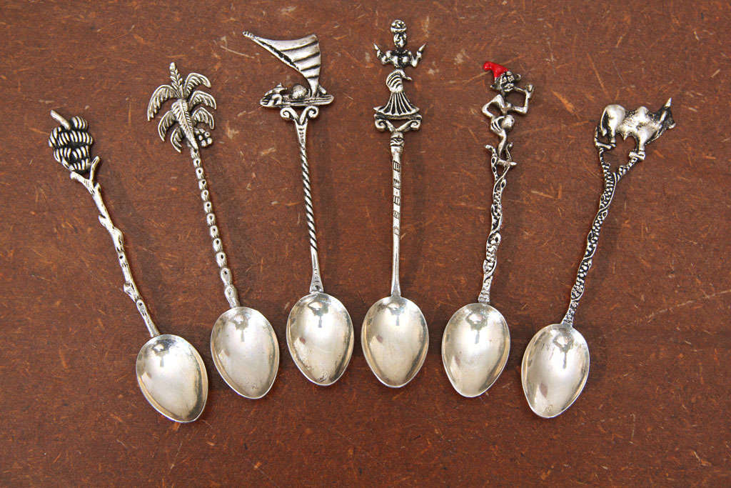 Tropical themed-sterling silver demitasse spoons. Includes one of each theme: Banana stock, bull with hump, shells and 