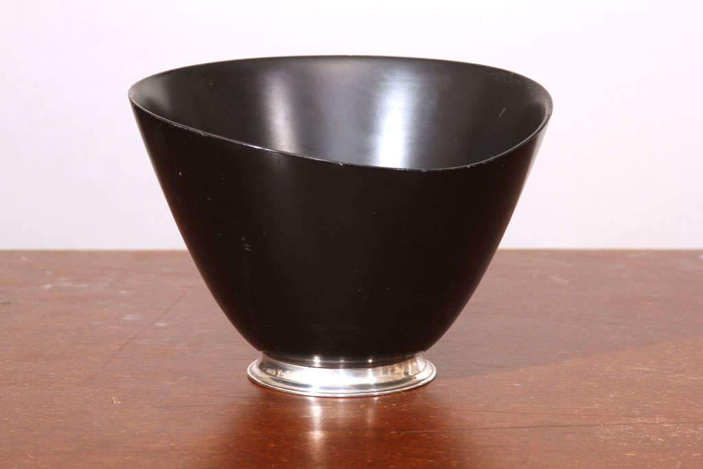 Hand turned black mahogany wood salad bowl on sterling silver. Sides are different height levels. Matching salad spoon and fork available as separate purchase.
