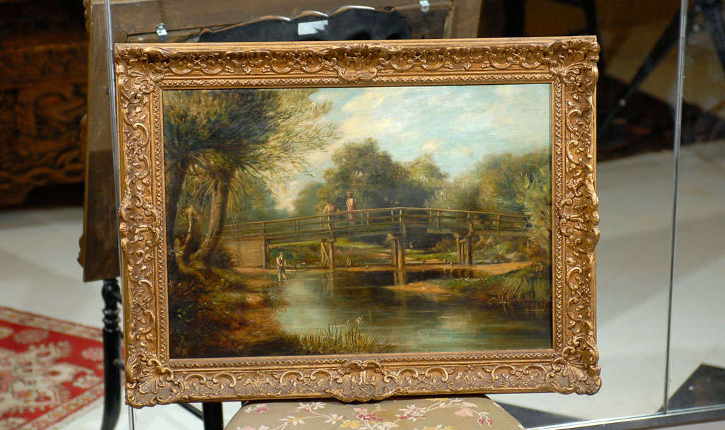 19th Century oil on canvas by artist W. Ray of an English landscape of gentlemen fishing on a wooden bridge.  Signed 'W. Ray 1890' in the bottom left corner and held by the original frame.