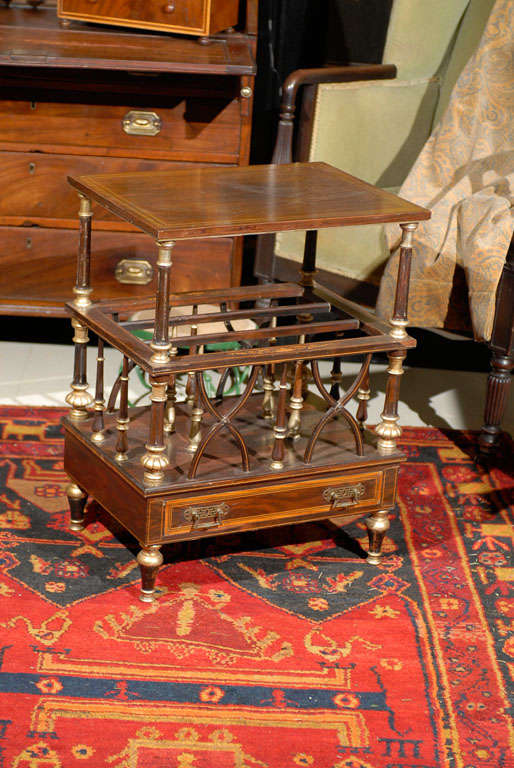 American mahogany magazine stand with satinwood inlays and painted gilt details.
