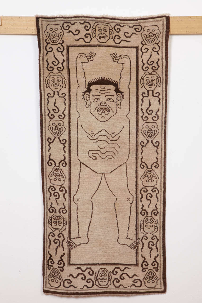 A rare example of Tibetan tantric rug, employed by Vajrayana Buddihsts as seats of power during the practice of esoteric rites associated with protective deities. 
The peculiar imagery depicted in these rugs symbolize the power of detachment from