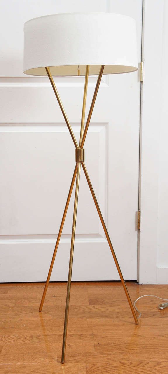 Vintage, mid century, tripod floor lamp.  The perfect reading lamp, with simple, clean lines.  On-off pull chain, controls three sockets.  Fitted with a light-shield enamel diffuser and an ecru linen shade.  Designed by T.H. Robsjohn-Gibbings.