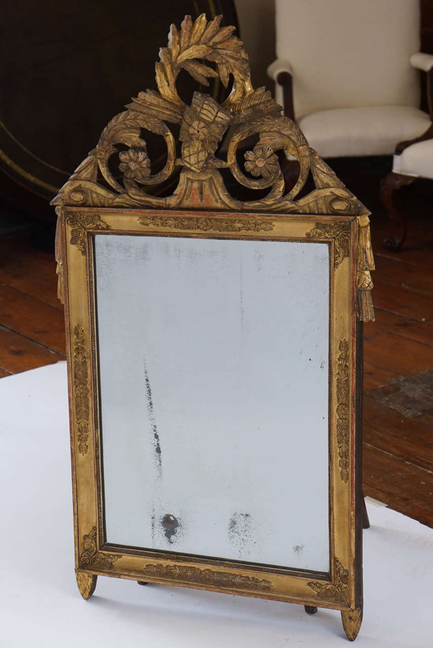 French Provincial Empire period carved gilt wood frame mirror with original mirror plate and gilt finish. 