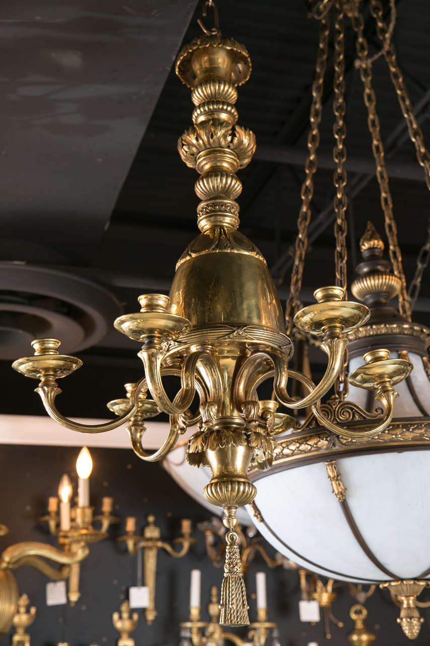 A wonderful six-light, circa 1920s gilt bronze Caldwell chandelier. Neoclassical style. Will be newly wired upon purchase.