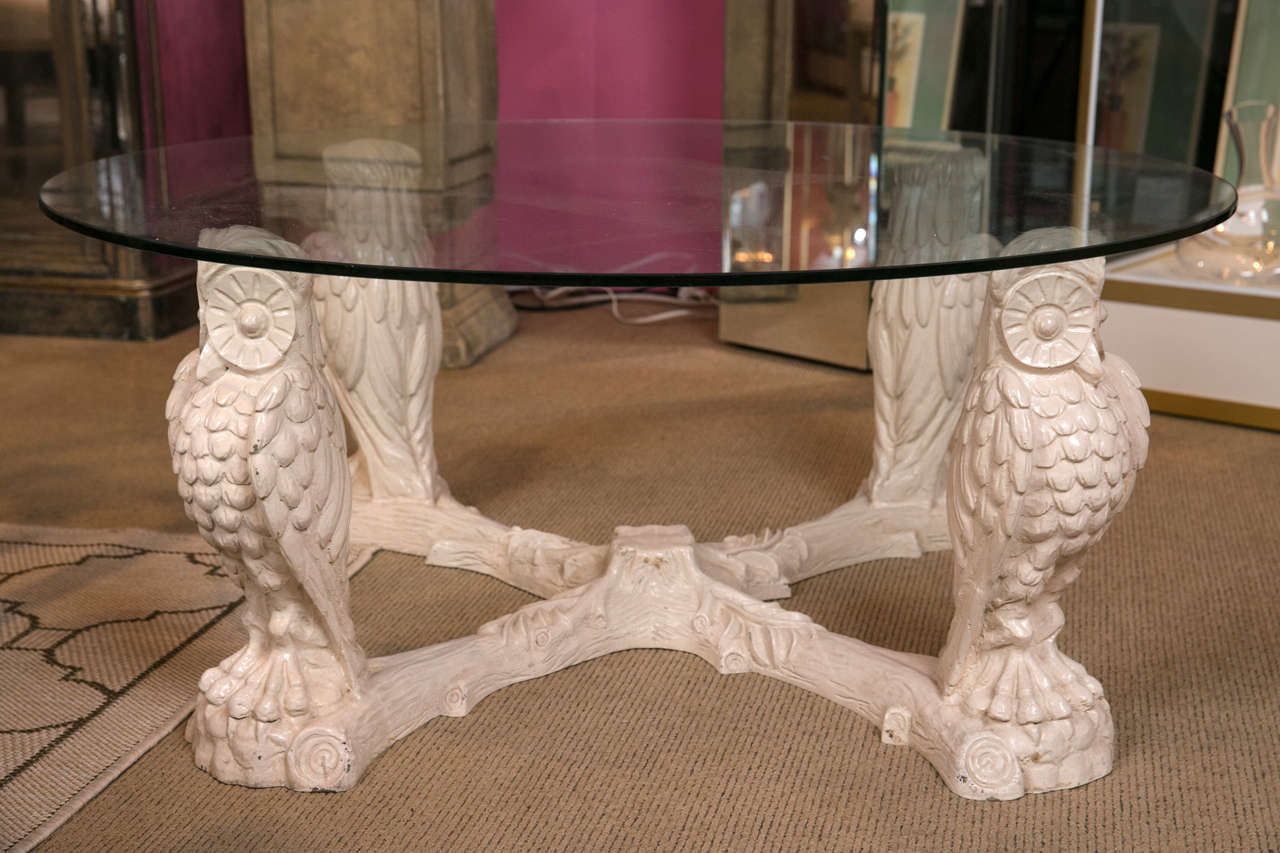 A wonderful Mid-Century glass top coffee table, featuring four owls as the base.