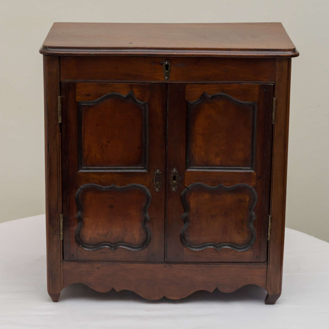 Late 18th century French miniature walnut armoire. Top compartment and fitted with three drawers below. Brass hardware. Perfect as a jewelry box. Very good detailed construction and dovetail drawers.