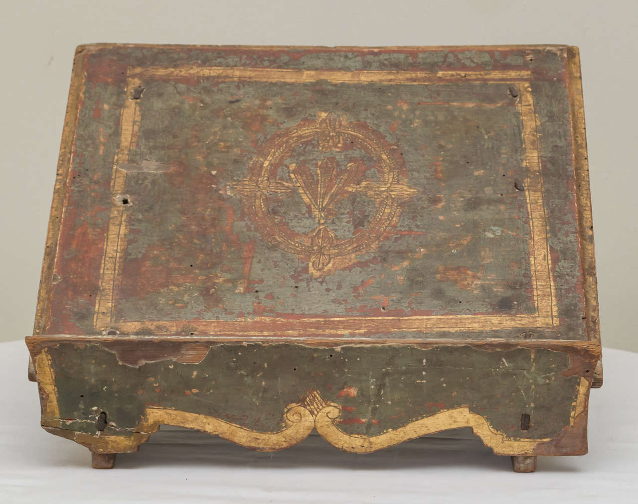 18th century. Italian book slant/holder. Retains a distressed old green paint and gilt finish. Good aged crackle. Unrestored.