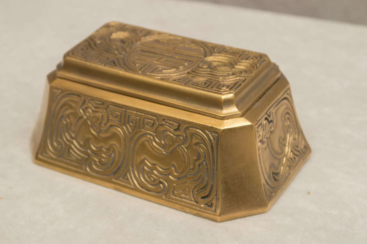 We don't have to tell you about the quality you get when you buy Tiffany Studios. This beautiful double inkwell in a dore finish will change the look of any desk, and make it more important looking. It is properly signed, and has the 2 original