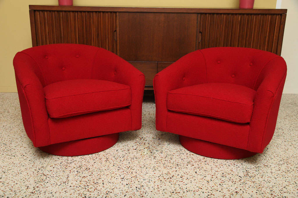 SOLD MAY 2011 Deep cinnabar red boucle fabric dress this pair of Milo Baughman armchairs on swiveling bases.  Quite handsome with original button tufting detail and classic Baughman lines.  Red hots!<br />
<br />
Price is for the pair.