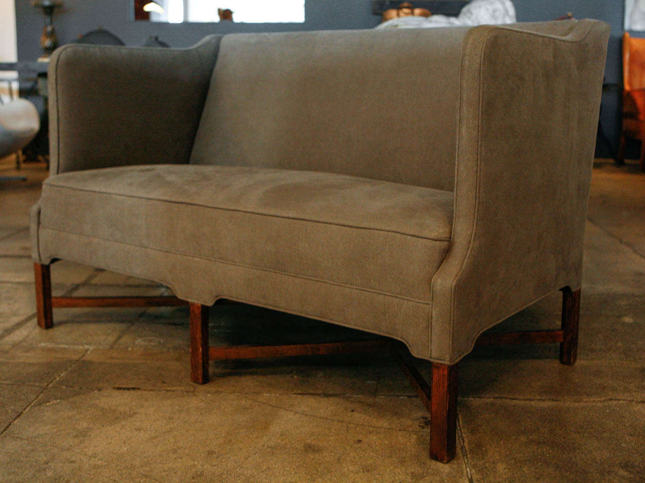 one of our favorites of all designs , kaare klint's 2-seater sofa. newly reupholstered in dark gray de la cuona linen & it's original cuban mahogany
cross frame.
