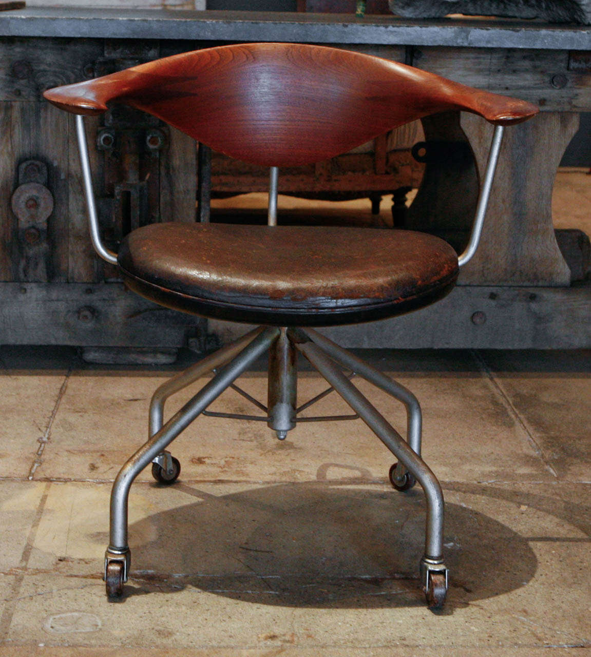 Hans Wegner's swivel chair produced & stamped by Johannes Hansen.