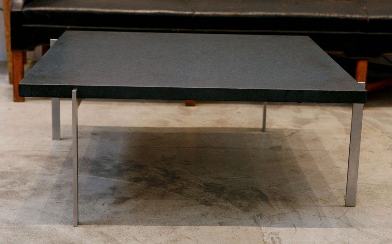 poul kjaerholm's pk61 coffee table with it's original black honed slate & stainless steel base. produced & stamped by e kold christensen.