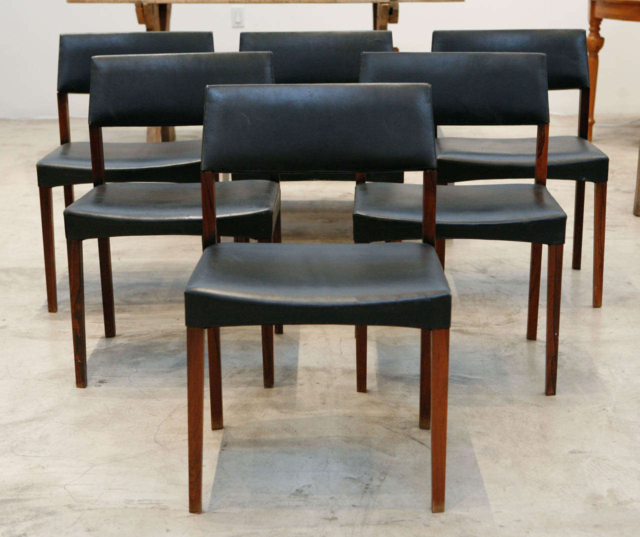 a set of six swedish dining chairs in their original black leather & rosewood frames. designer unknown
*only sold as a set.