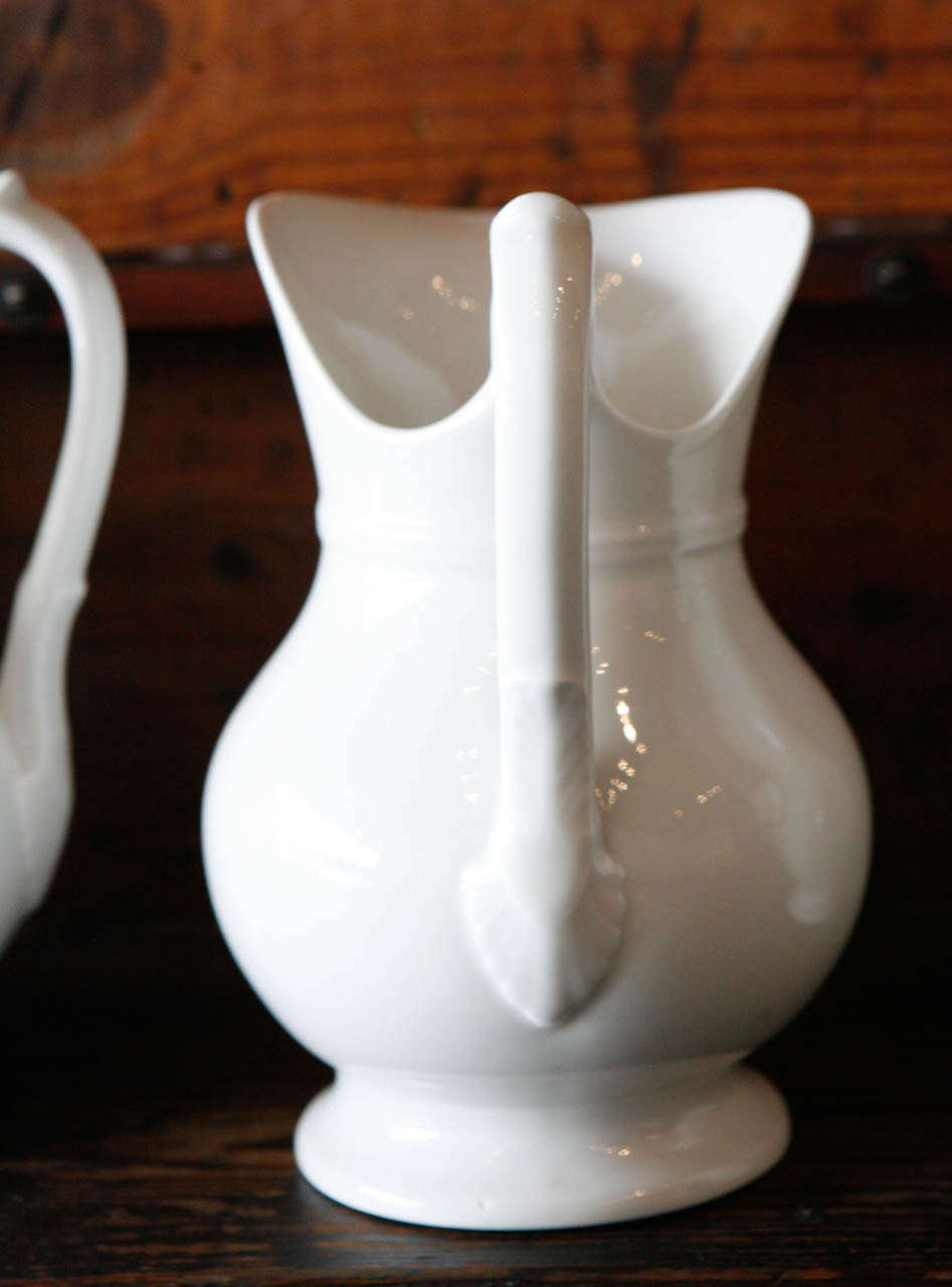 A Set of Eight Ironstone Pitchers, France 1