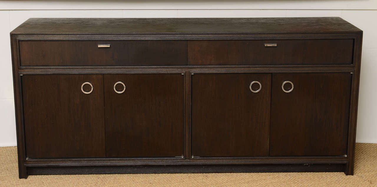 Features two drawers and four more doors for ample storage. Excellent nickel plated ringlet door pulls, all finished in a rich espresso satin oak.

This item is currently in our MIAMI facility. Please call or email us directly for details.