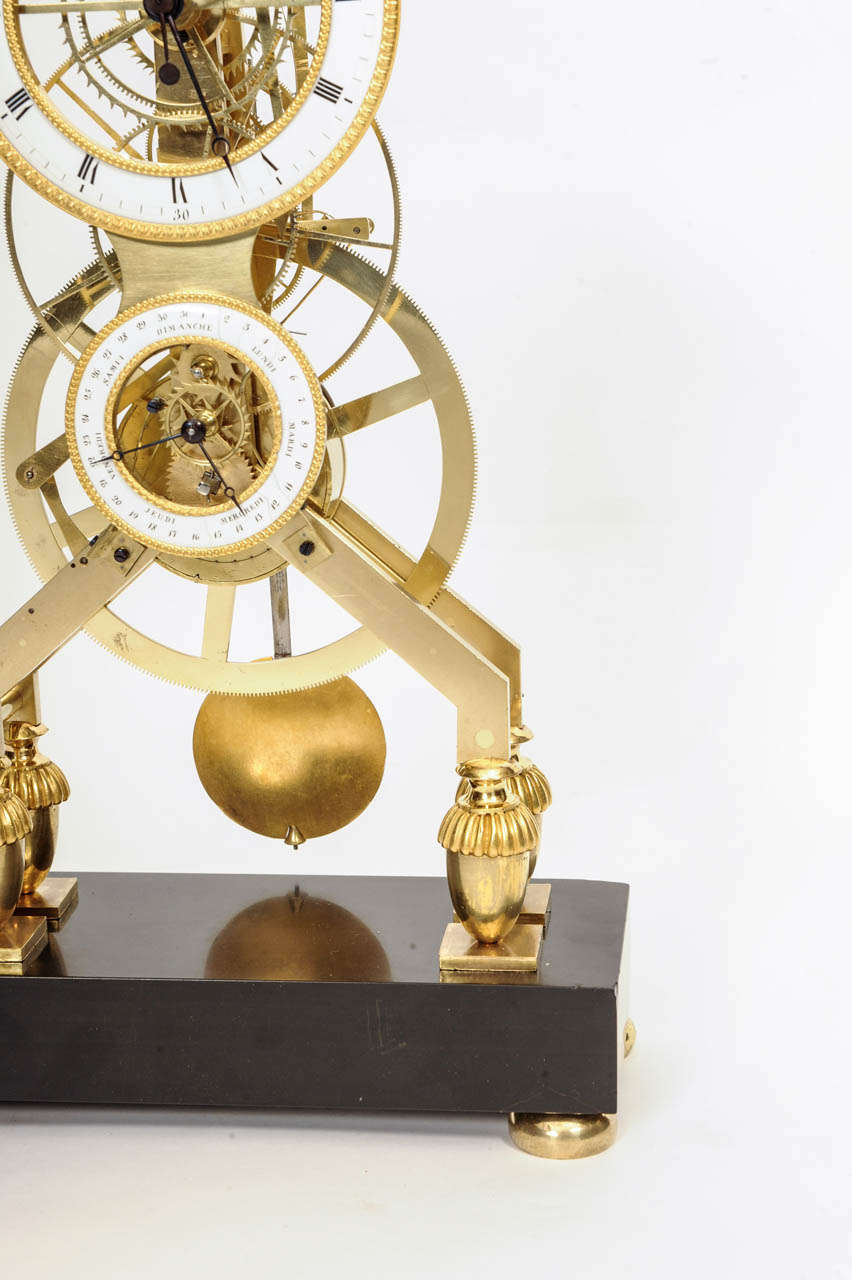 18th Century and Earlier French Directoire Brass and Black Marble Skeleton Mantel Clock circa 1795 For Sale
