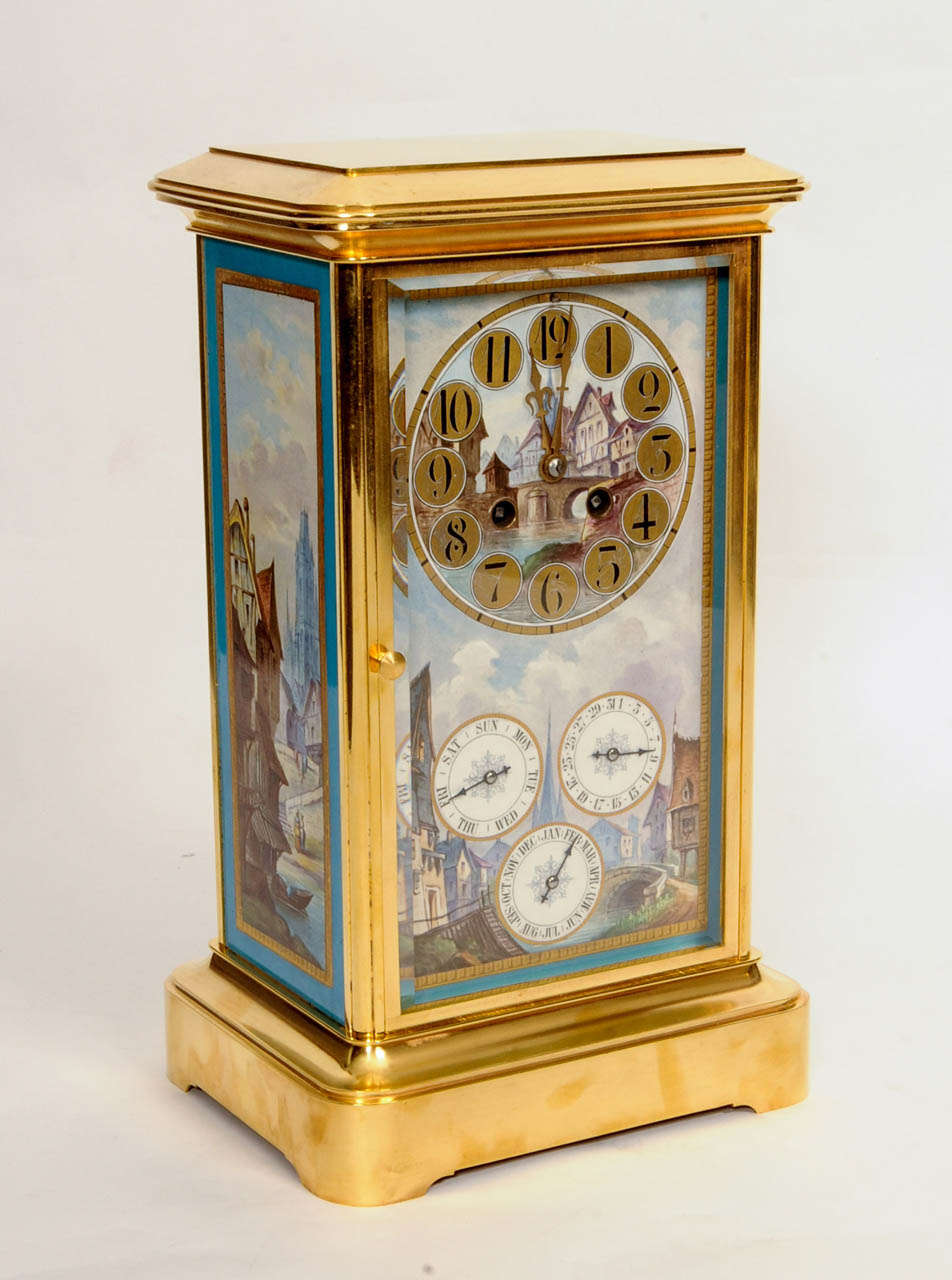 14-cm polychrome porcelain dial with gold and blue border, Arabic numerals with Asatian townscape in the centre, gilt hands, a similar townscape below with subsidiaries for day of the week, date and month, 8-day movement with Brocot escapement, rack