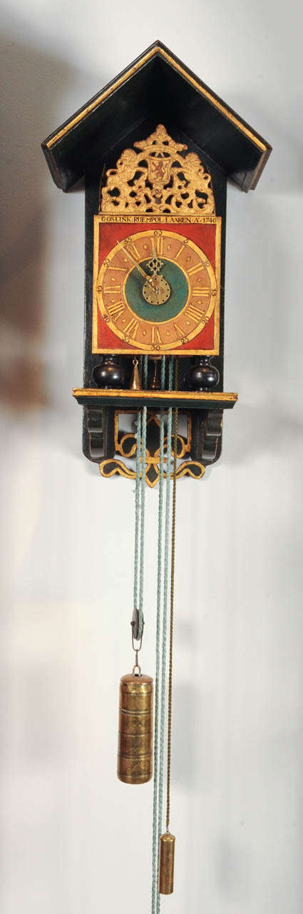 A rare Dutch Geldern polychrome painted alarm 'stoelklok', 19,5cm polychrome painted dial with Roman numerals, signed Goslink Ruempol Laaren 1746, shaped brass hands and alarm disc, substantial brass and iron posted movement with double top plate