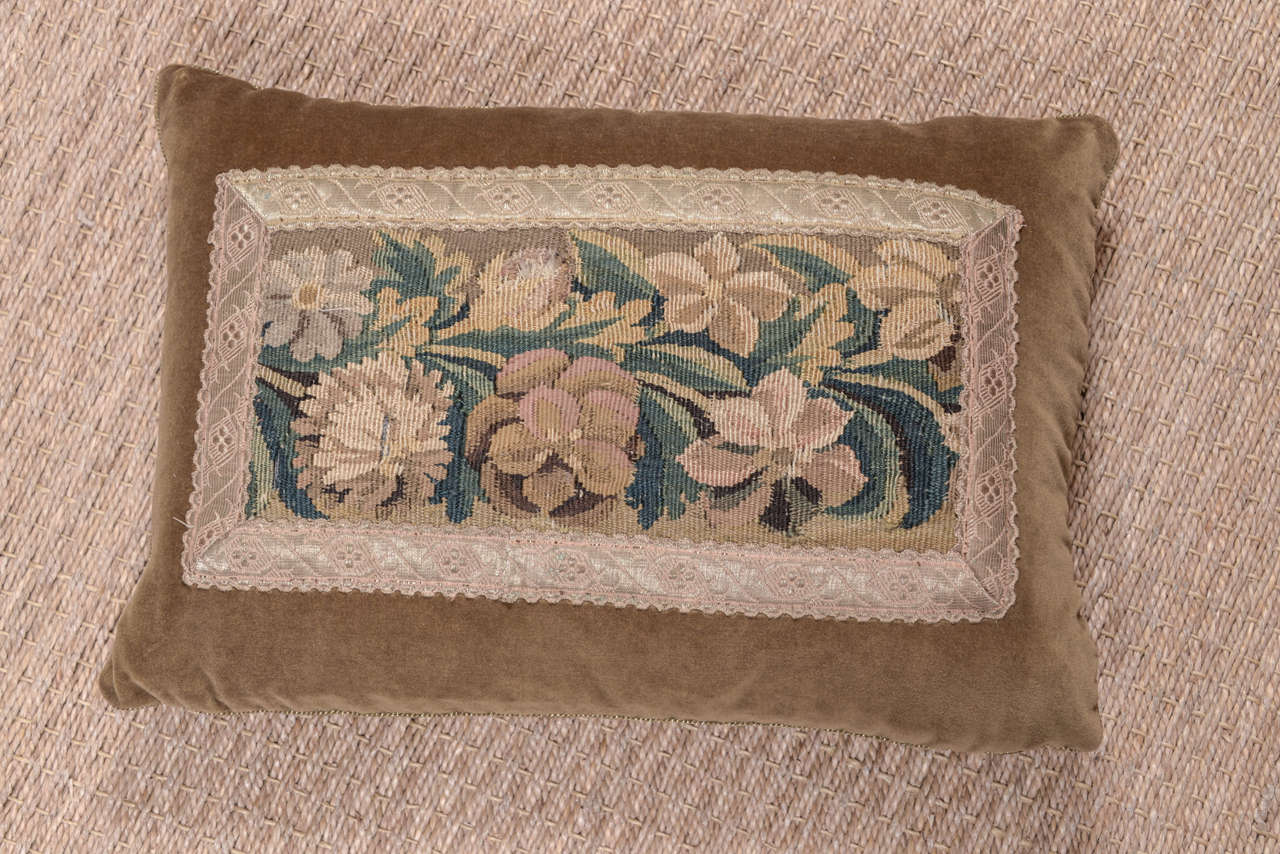 18th century floral tapestry pillow with antique French galon border. Down filled.