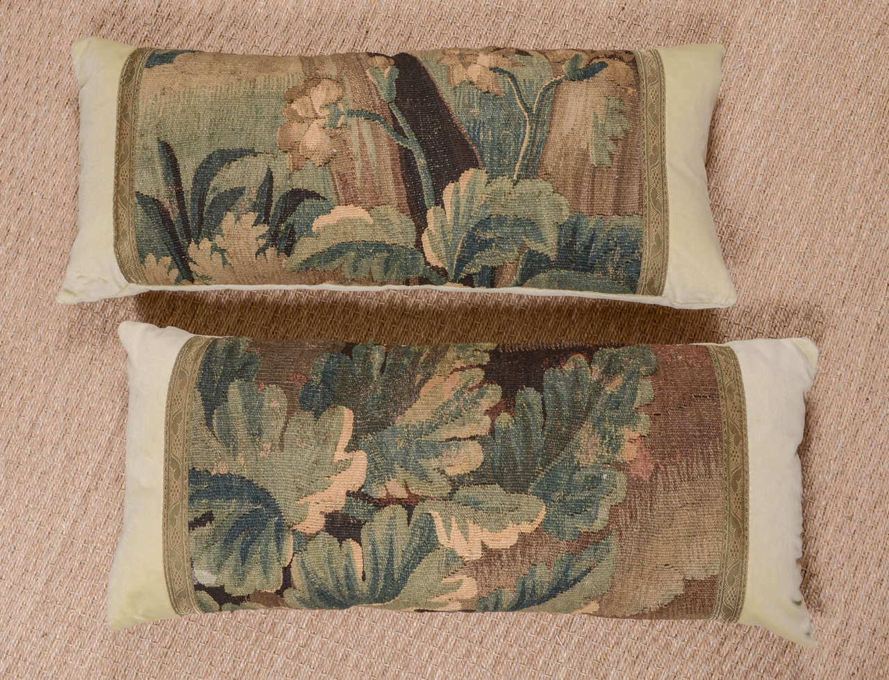 Pair of 18th century French tapestry fragment pillow depicting foliage from a larger tapestry.Tapestry is bordered with vintage gold metallic trim. Body of pillow composed of Citron colored  velvet. Down filled.

Custom Made from 18th century