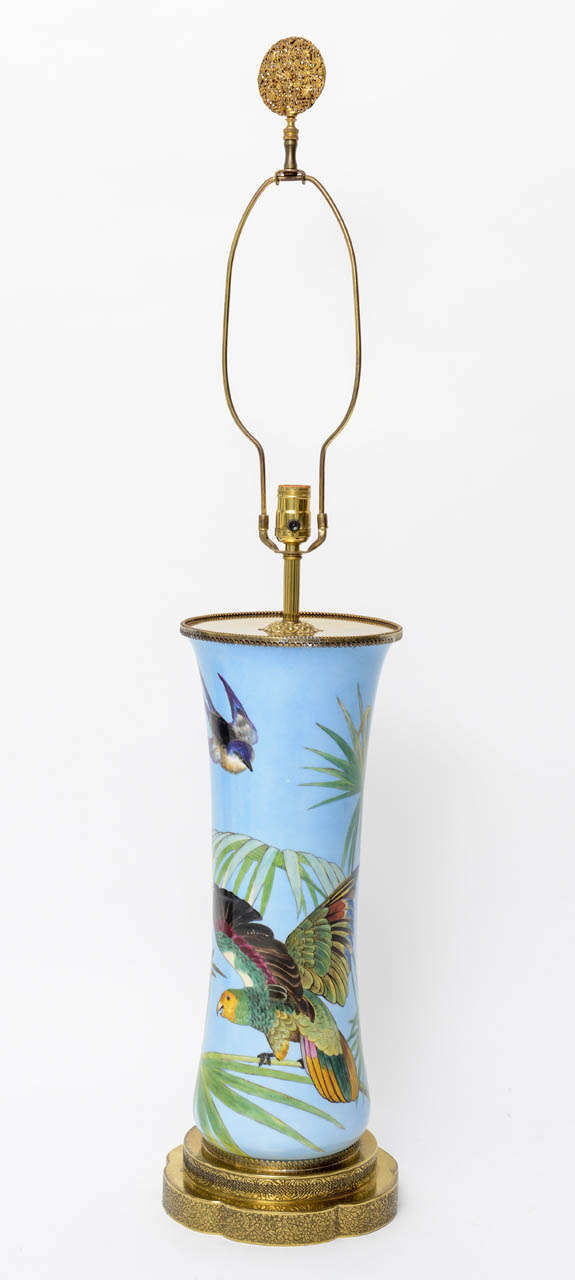 Lovely pair of bird motif ceramic vases converted into lamps with brass mounts and bases. Lamp measures 26.5 inches to top of socket.

Please feel free to contact us directly for any additional information or a shipping quote by clicking 