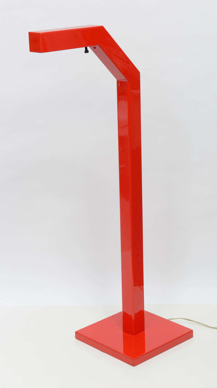 Big, bold lines are what this lamp is all about.  Redone in glossy bright red, this lamp adds a pop of color to the corner of any sitting area.  Made of heavy steel.