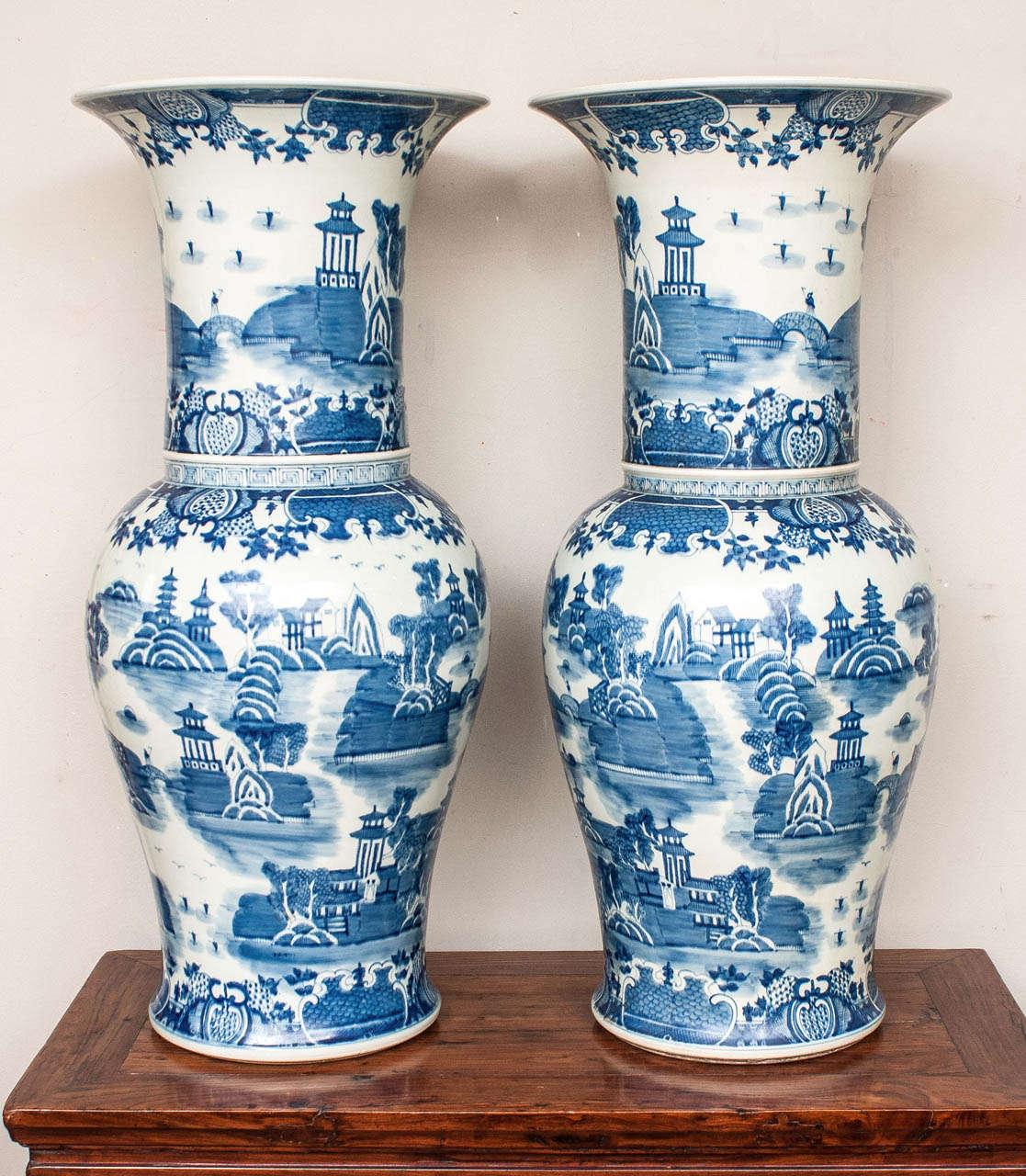 Impressive pair Chinese Palace Jars hand painted with traditional pagoda and landscape motif.