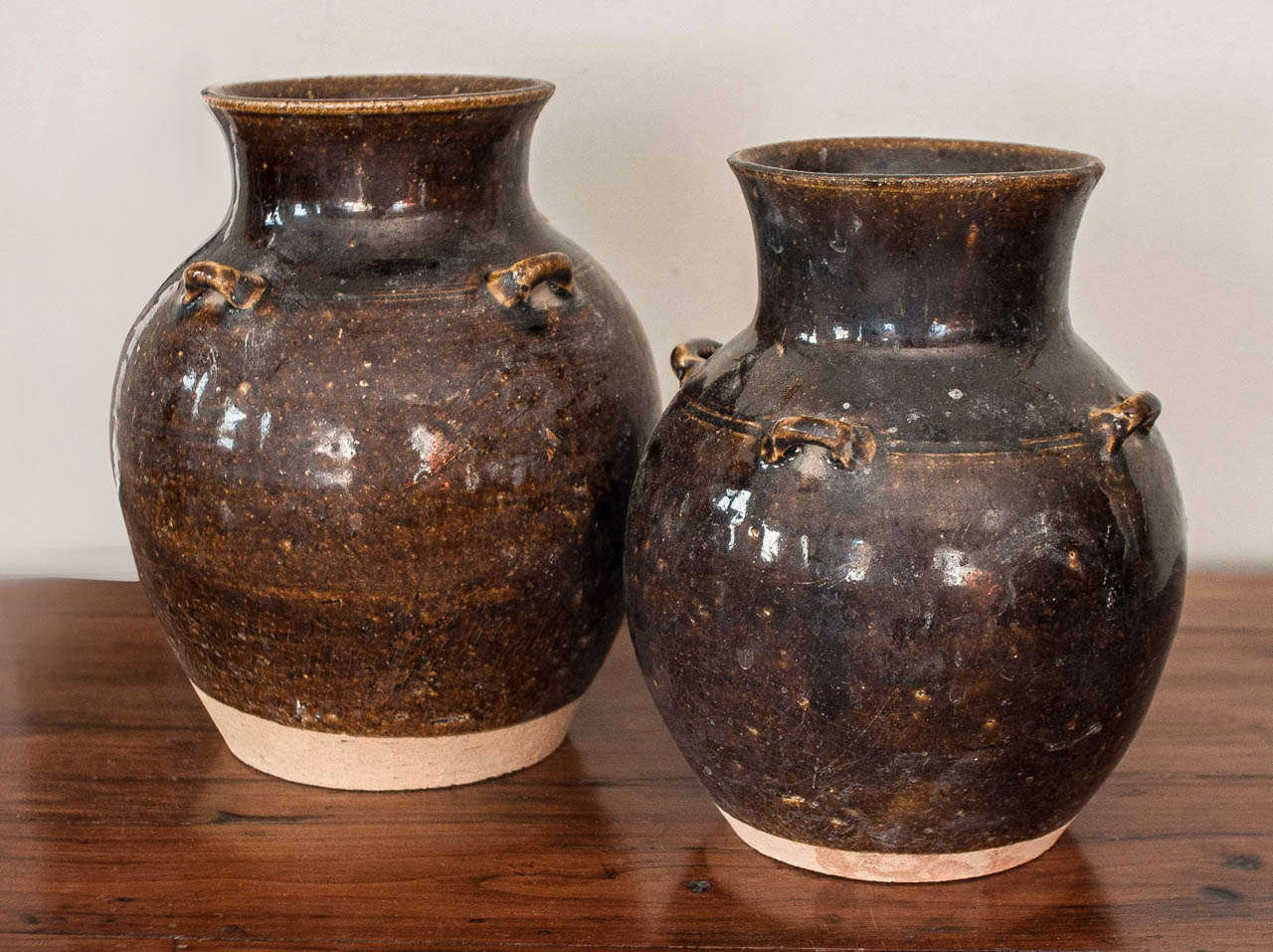 Two Chinese brown glaze ceramic pots with lug handles.