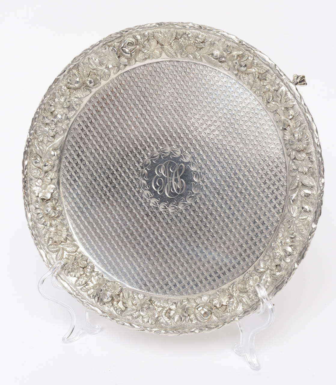 Sterling Silver Waiter/ Charger by Samuel Kirk & Son Co., Baltimore, Maryland, USA.  Circular tray having ornate repousse floral border & textured surface, raised on claw & ball feet

Originally $ 3,200.00

CHECK OUR INVENTORY FOR ADDITIONAL