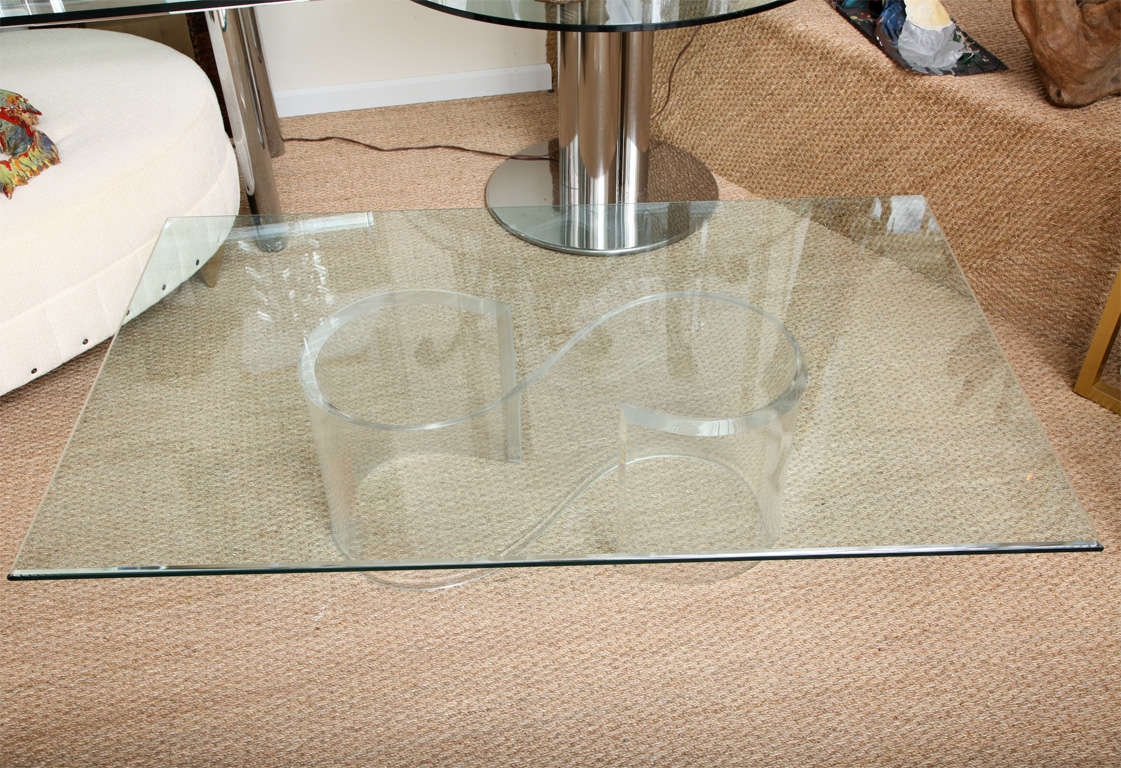 Lucite coffee table S design with beveled glass top.