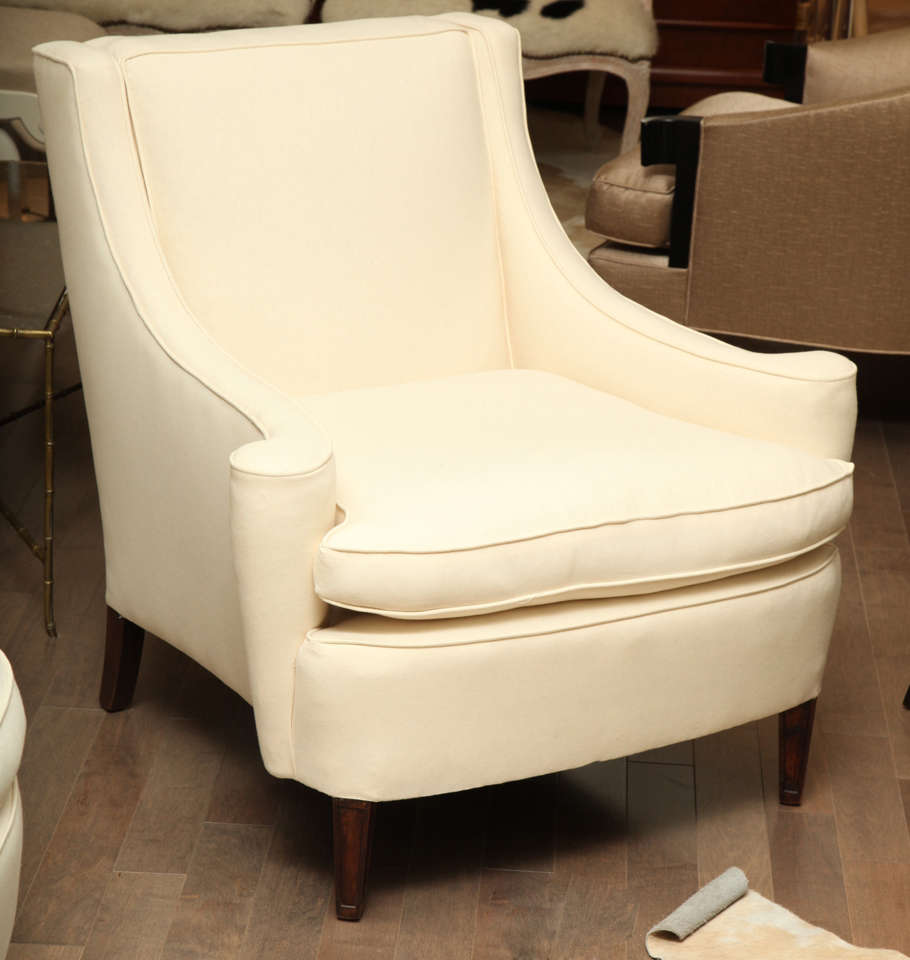 Comfortable lounge chair with a graceful scroll arm by Duane Modern.
Made to order.