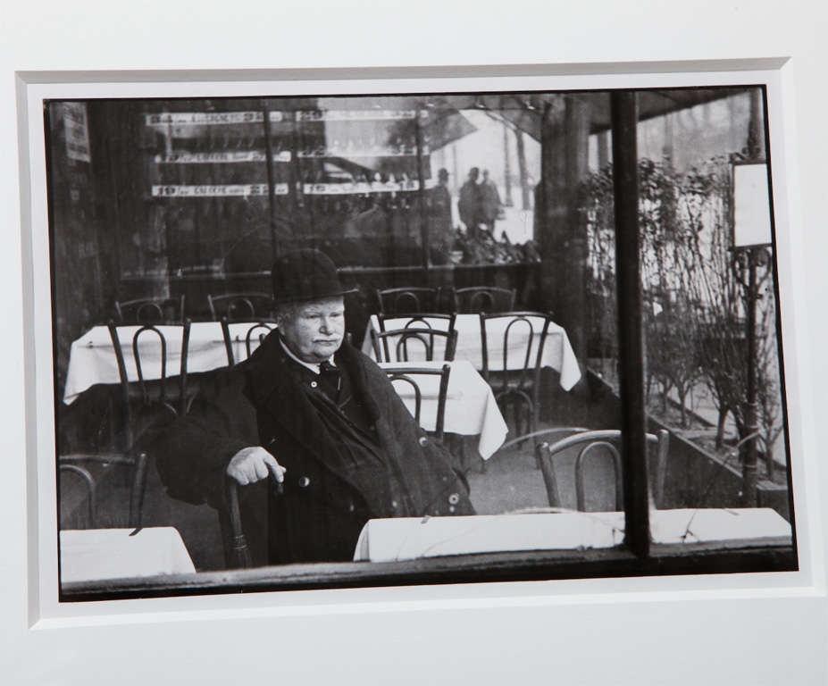 An early, original silver gelatin photograph by the celebrated photographer, Henri Cartier-Bresson in a wooden frame underneath Conservation Grade glass.

The image is a famous one from the photographer, titled 