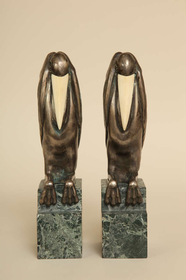 Silvered bronze marabouts with bone beaks on a green marble pedestal.
Signed:  Bouraine/ 127/ MADE IN FRANCE

*Variety of other pairs of bookends available.