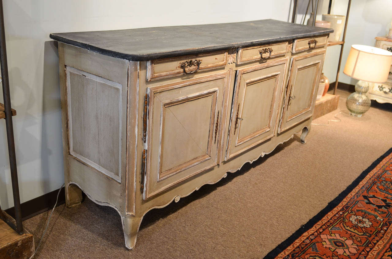18th Century Painted Oak Enfilade From Brittany, Circa 1775
This is a good substantial piece which would have originally been used in a dining room for serving food.  It would do well for that purpose today but we also find that this sort of piece
