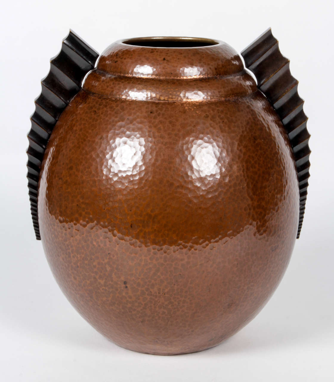 SEVARD  France (active 1920's/1930's)

Dinanderie vase  with fish fins c. 1925

Hand wrought and hand hammered copper with a rich chocolate-brown 
patination and bronze fin-like handles, gilt detailing

Marks:  Sevard (inscribed signature),